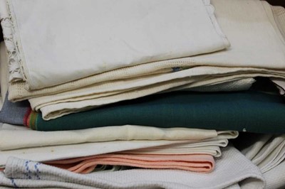 Lot 2107 - A quantity of table linens including embroidered and lace cloths, and mats, Linen table cloth with blue embroidered Oriental inspired design. Plus some 1950's aprons and some small handkerchiefs.