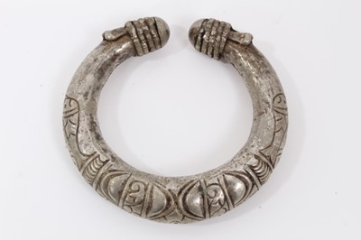 Lot 803 - North African silver torque, decorated with fish and geometric motifs, 10cm wide
