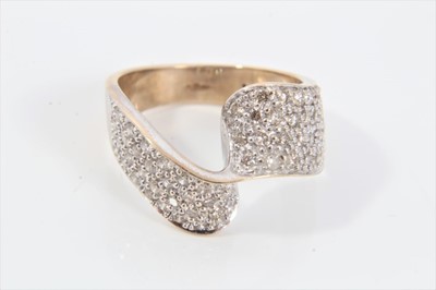 Lot 621 - Diamond dress ring with a cross-over band of pavé set diamonds estimated to weigh approximately 1ct in 9ct gold setting. Ring size approximately N.