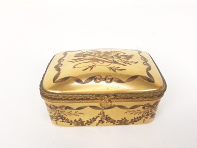 Lot 1931 - French ormolu-mounted porcelain box, late 19th century, probably Limoges, gilded and enamelled en grisaille with swags of flowers and other motifs, marks to base, 11cm across