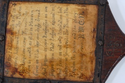 Lot 1942 - Rare 18th century child's horn book, inscribed with the Lord's Prayer, the thin sheet of horn held in place with black metal surround, on a wooden bat-shaped frame with T-shaped handle and engraved...