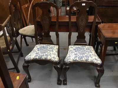 Lot 933 - Set of four Dutch carved walnut chairs with drop in seats