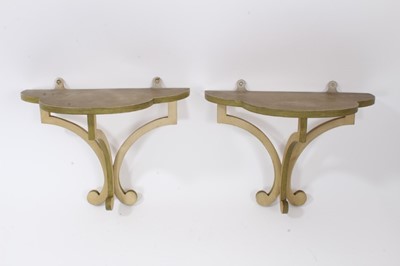 Lot 896 - Pair of painted wooden Colefax and Fowler wall brackets each with trefoil form shelf on scrolling supports, 27cm wide. From a commission by Lord and Lady David Cholmondeley
