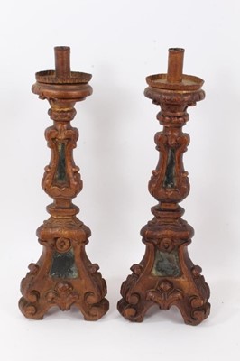 Lot 928 - Pair of 19th century Italian carved altar candlesticks, 44cm high