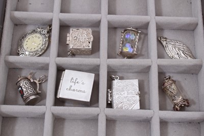 Lot 270 - Collection of silver and white metal charms within a Stackers jewellery box