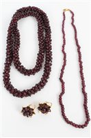 Lot 3306 - Garnet bead necklace with gold (18ct) clasp,...