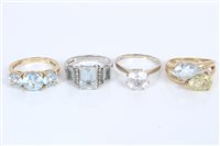 Lot 3307 - Three gold (9ct) gem set dress rings and one...