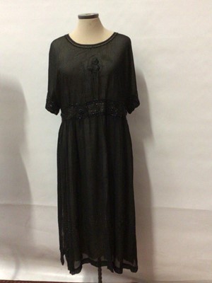 Lot 2052 - Circa 1910  Black silk crepe evening dress with geometric beading over a cream silk under dress.