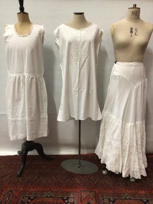 Lot 2059 - Three Edwardian white cotton dresses with broderie anglaise eyelet embroidery and lace plus three cotton petticoats.