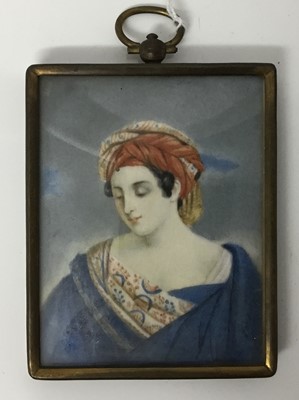Lot 243 - Early 19th century watercolour portrait miniature on ivory, half length depiction of a woman in turban, 8 x 6.5cm, glazed metal frame