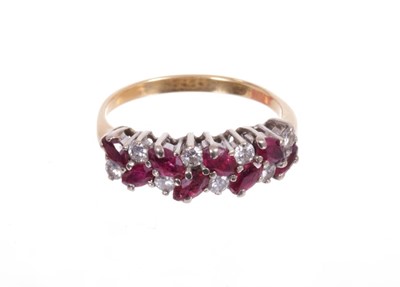 Lot 545 - Ruby and diamond half hoop ring