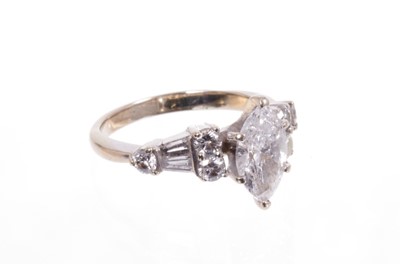 Lot 553 - Diamond single stone ring with a marquise cut diamond weighing approximately 0.97cts. together with a wedding ring