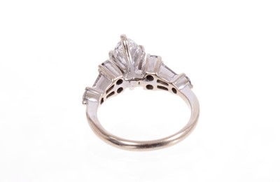 Lot 553 - Diamond single stone ring with a marquise cut diamond weighing approximately 0.97cts. together with a wedding ring