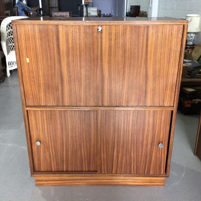 Lot 1001 - Mid century rosewood drinks cabinet on plinth base