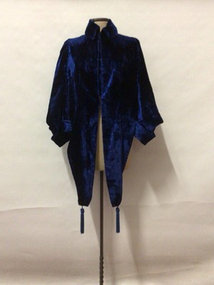 Lot 2071 - 1920's Art Deco Blue velvet evening jacket, cropped back and long front panels with tassels, with two tone blue lining.