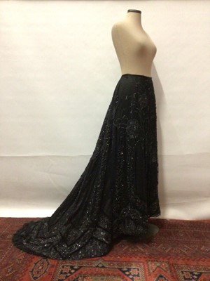 Lot 2072 - Victorian Black Evening Skirt with train, satin overlaid with net decorated with beads, sequins and ribbons.