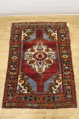 Lot 1516 - Three rugs to include a Kazak, Konya Turkey rug and Malatya rug