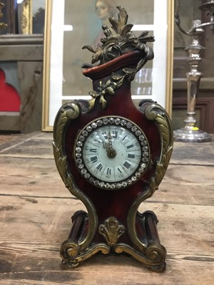 Lot 85 - Late 19th century French tortoiseshell shell veneered timepiece with cast gilt brass mounts and paste set bezel. 21cm