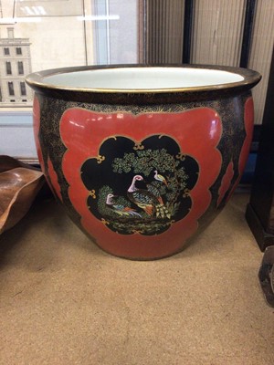 Lot 132 - Carlton Ware jardiniere, decorated with tropical birds on a red and gilt ground