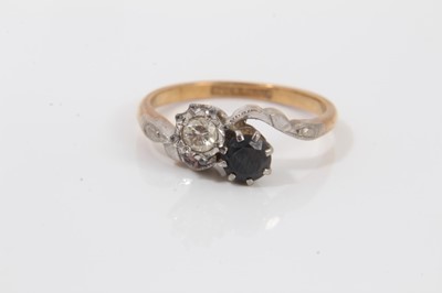 Lot 35 - 18ct gold diamond and sapphire crossover ring