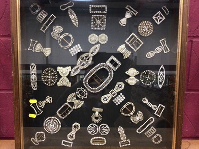 Lot 2167 - Collection of antique paste buckles in glass fronted display case