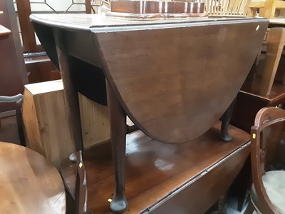 Lot 931 - Georgian mahogany oval dropleaf dining table on taper legs and pad feet and Georgian wine table (2)
