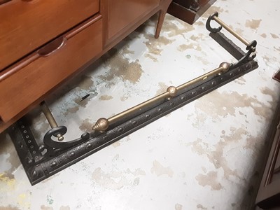 Lot 1036 - Victorian brass and iron fender, 136cm wide
