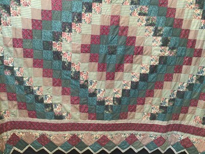 Lot 2077 - Patchwork quilt, machine and hand stitched with chevron edges.  Single bed size.