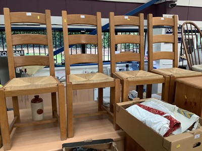 Lot 946 - Pine oval breakfast table on pedestal base and four pine ladder back chairs with rush seats