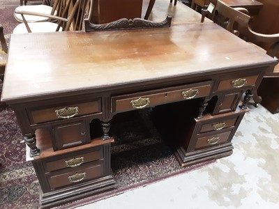 Lot 1063 - Late Victorian walnut kneehole desk with drawers and cupboards below, 126.5cm wide, 55cm wide, 83cm high