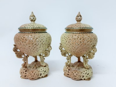 Lot 1161 - Pair of Royal Worcester Blush Ivory reticulated Pot Pourri vases and covers