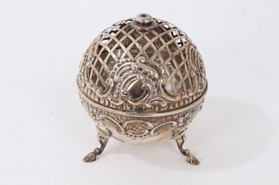 Lot 146 - Victorian silver pot pourri dome of spherical form with embossed decoration, pierced hinged cover, raised on three feet