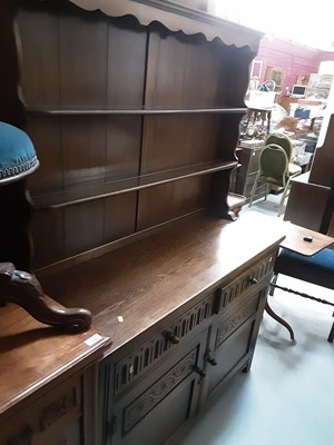 Lot 1087 - Oak two height dresser with shelves above, two drawers and two panelled doors below, 121cm wide, 44cm deep, 174.5cm high