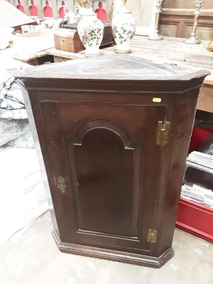 Lot 1111 - Two 18th century oak hanging corner cupboards and carved oak framed mirror