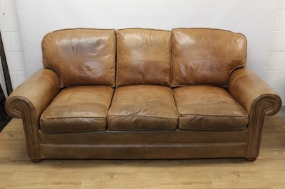 Lot 1392 - Modern tan leather three seater sofa