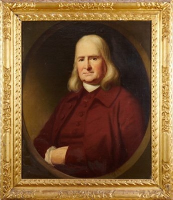 Lot 1216 - English School, early 18th century, oil on canvas laid on board - half length portrait of a Gentleman in red coat, painted within an oval, 74cm x 61cm, in period carved giltwood frame