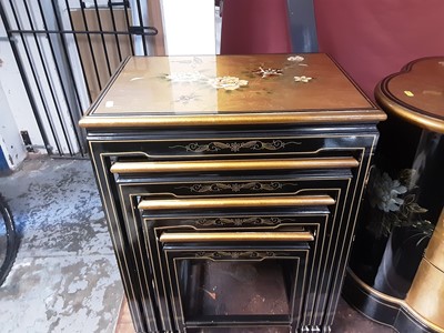 Lot 1149 - Oriental lacquered nest of four occasional tables decorated with flowers and birds