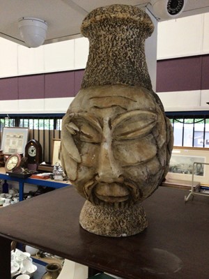 Lot 235 - African carved greenstone vase with mask decoration on both sides, 40cm high