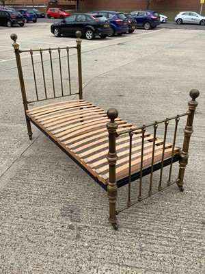Lot 1190 - Victorian brass single bed with side irons and slatted base
