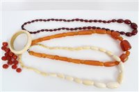 Lot 3323 - One antique ivory bead necklace, ivory bangle,...