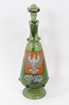 Lot 222 - Unusual Bohemian green glass decanter, enamelled with the Polish coat of arms, inscribed below and dated 1866, decorated with raspberry prunts and enamelled patterns, 38.5cm high