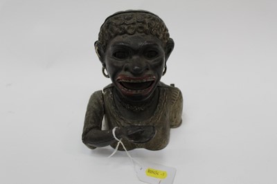 Lot 2474 - Early 20th century cast iron “Dinah” mechanical money box, with moveable arm, tongue and eyes, Rd No 581285, probably manufactured by John Harper & Co Ltd. Replacement base). 17cm overall height.