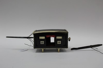 Lot 2454 - Rare early 19th century Anglo Indian horn and ivory model of a Palanquin with red velvet lining, sliding doors, shutters, lamp and carrying poles. 17cm overall length, excluding carrying poles