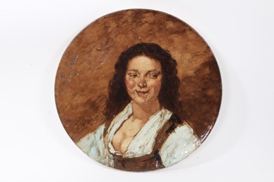 Lot 150 - 19th century continental pottery charger, hand painted with a woman, dated 1879 to reverse