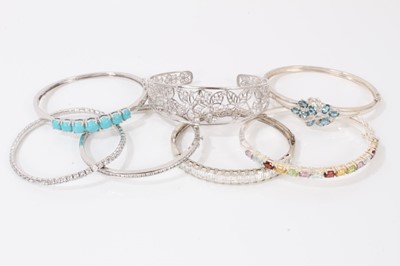 Lot 69 - Seven contemporary silver paste and gem set bangles