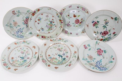 Lot 126 - Seven Chinese famille rose dishes, Qianlong period, decorated with flowers, birds and fenced gardens, including two pairs, each approx 23cm diameter