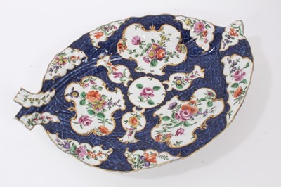 Lot 157 - A Worcester cabbage leaf shaped dish, with flowers on a blue scale ground, circa 1770
