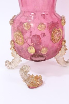 Lot 128 - Impressive late 19th century Murano glass covered goblet, decorated with gold serpents, together with a pair of Murano cranberry glass vases, decorated with gold prunts, lion masks and scrollwork f...