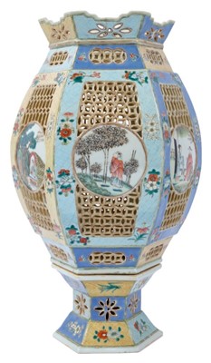 Lot 129 - Chinese famille rose reticulated lantern, 19th century, decorated with circular panels containing figural scenes, on a floral patterned ground, 39cm high