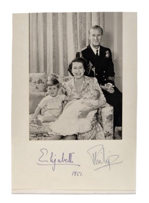 Lot 21 - T.R.H.The Princess Elizabeth and The Duke of Edinburgh, charming signed portrait photograph of the young Royal couple with a young Prince Charles and infant Princess Anne - signed in ink on mount'...